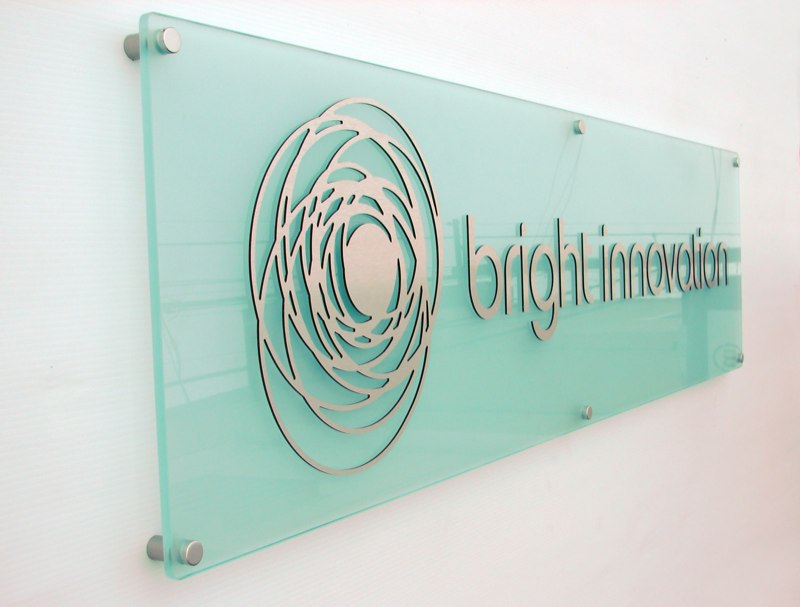 glass signage with stand offs